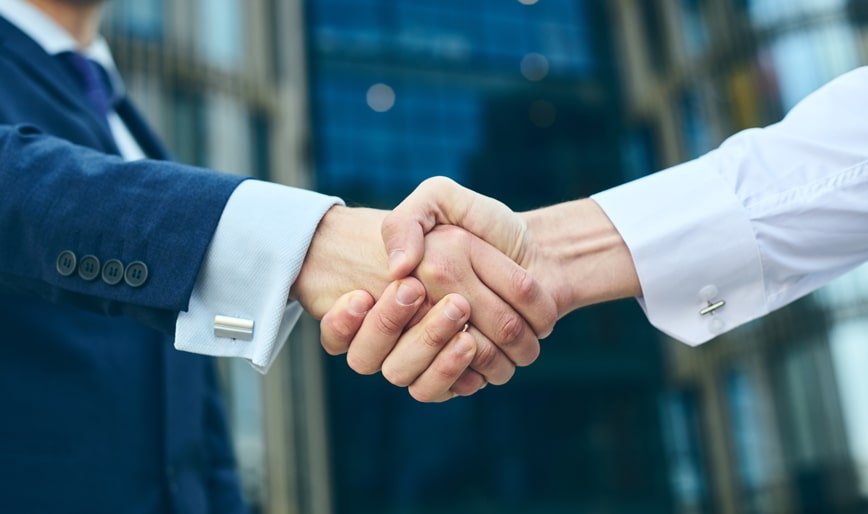 Professional business handshake representing partnership in digital market services in India