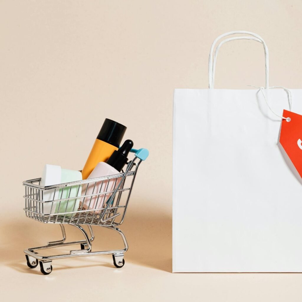 Online shopping concept with mini cart and shopping bag for e-commerce website solutions.